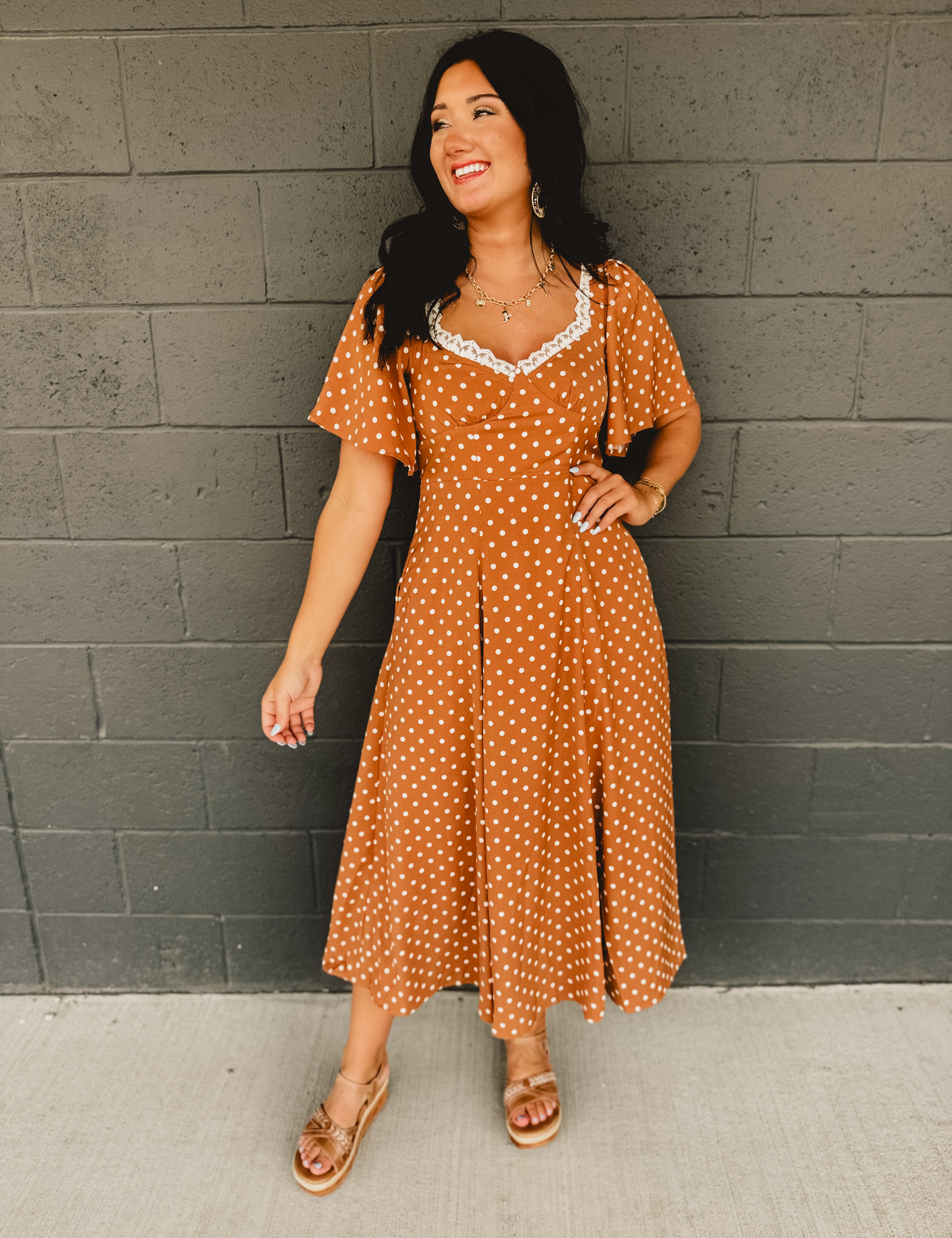 Sweetheart neckline short sleeved midi dress with back tie detail, polka dots, and hidden side pockets in the color Sepia(Camel).