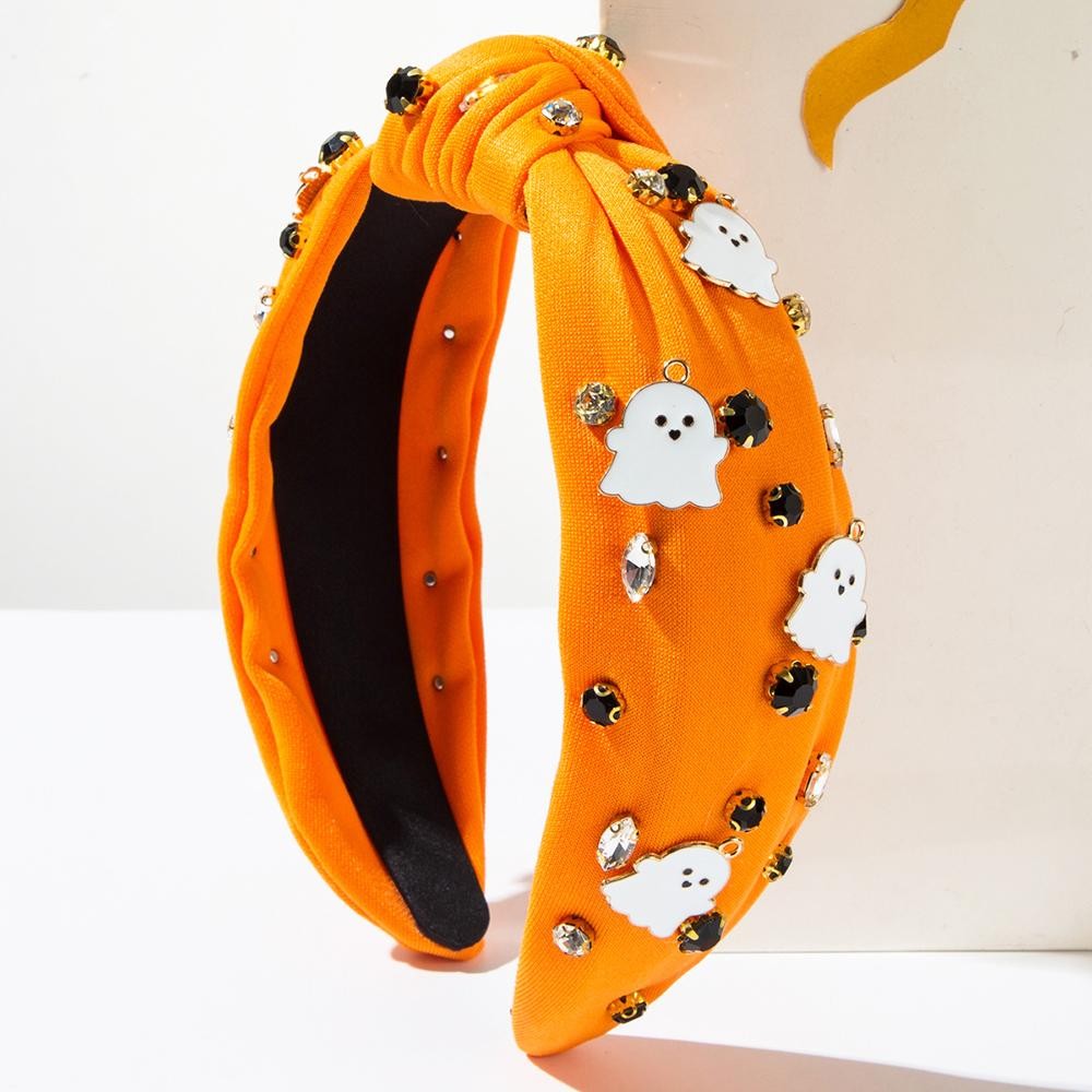 Ghost and gemstone studded organe knot headband.