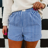 Blue/white gingham printed elastic waistband boxer shorts.