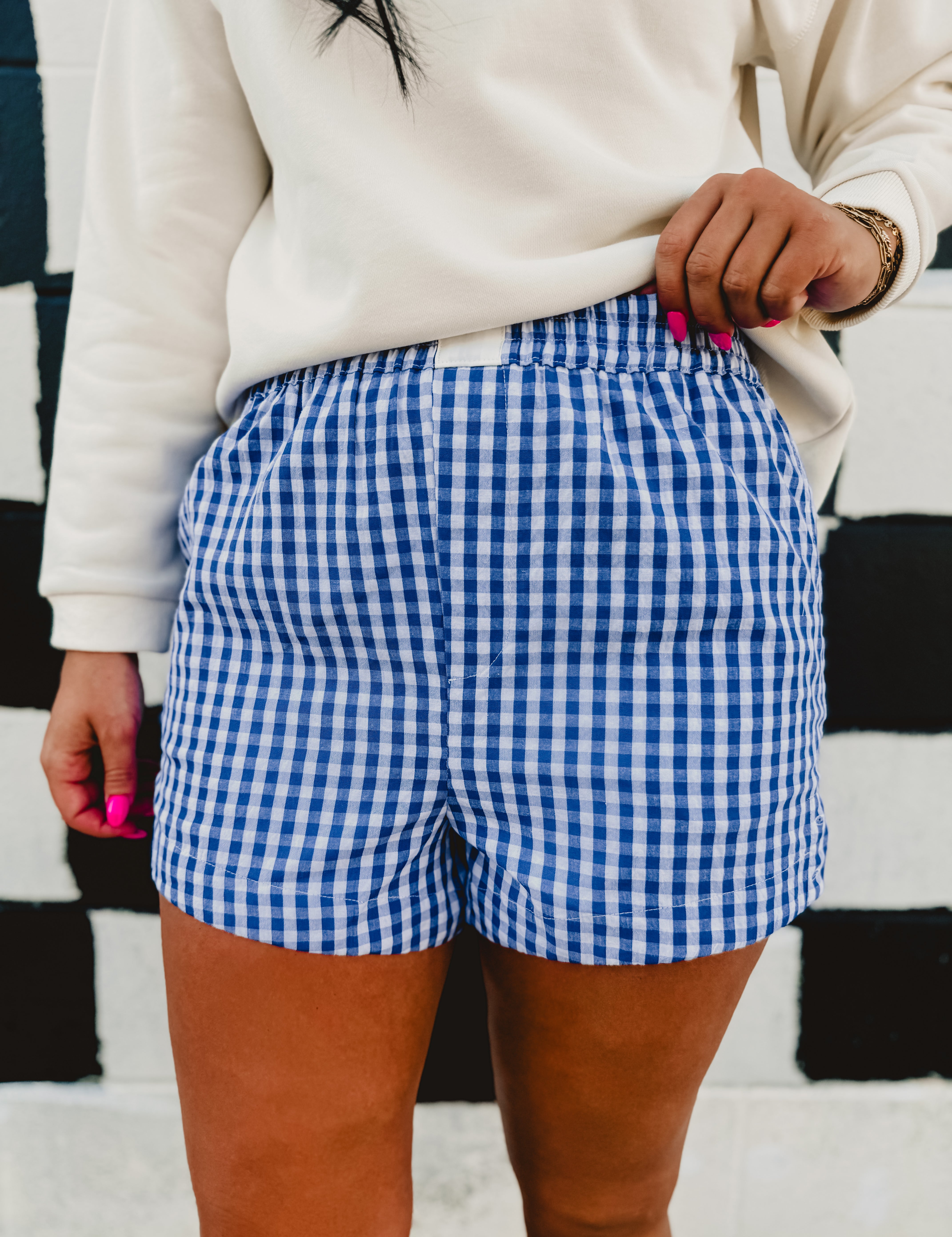 Blue/white gingham printed elastic waistband boxer shorts.