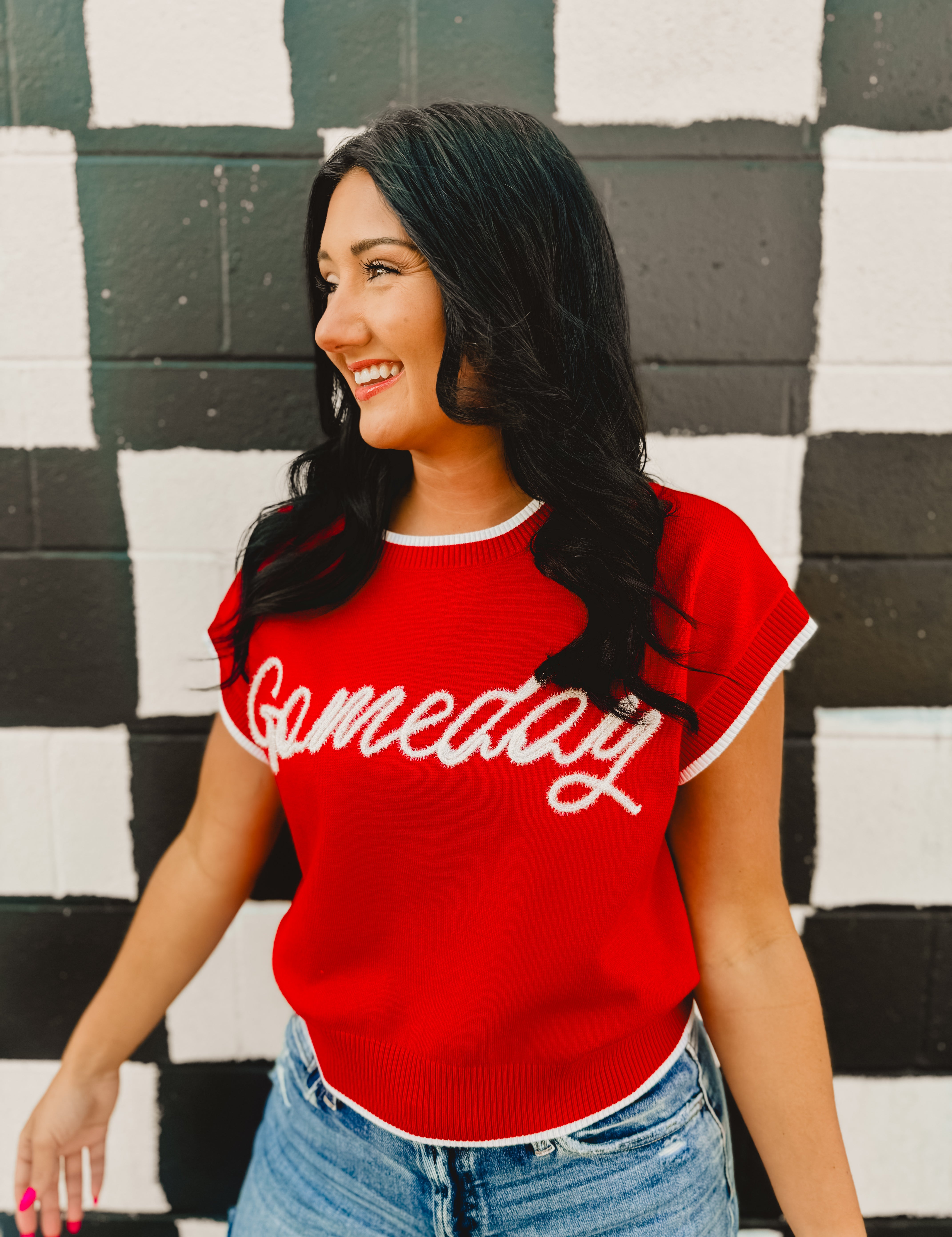 Glitter rope "Gameday" lettering on a red sweater tank with white trim contrast and a round neckline.