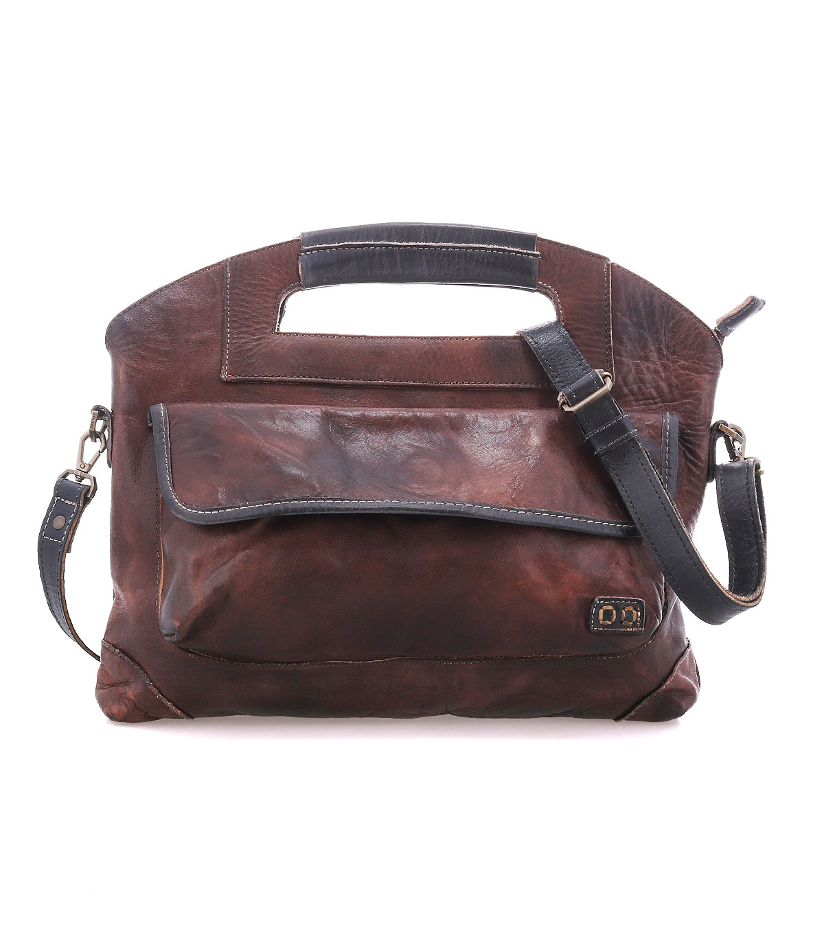 BedStu Greenway crossbody bag in teak rustic leather with black trim, showing the front flap pocket and adjustable crossbody strap