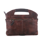 Back of the teak Greenway crossbody showing the exterior zip pocket and zip-top closure