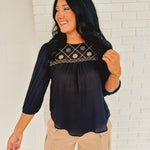 Half sleeve navy and beige blouse with embroidery and a boat neck.