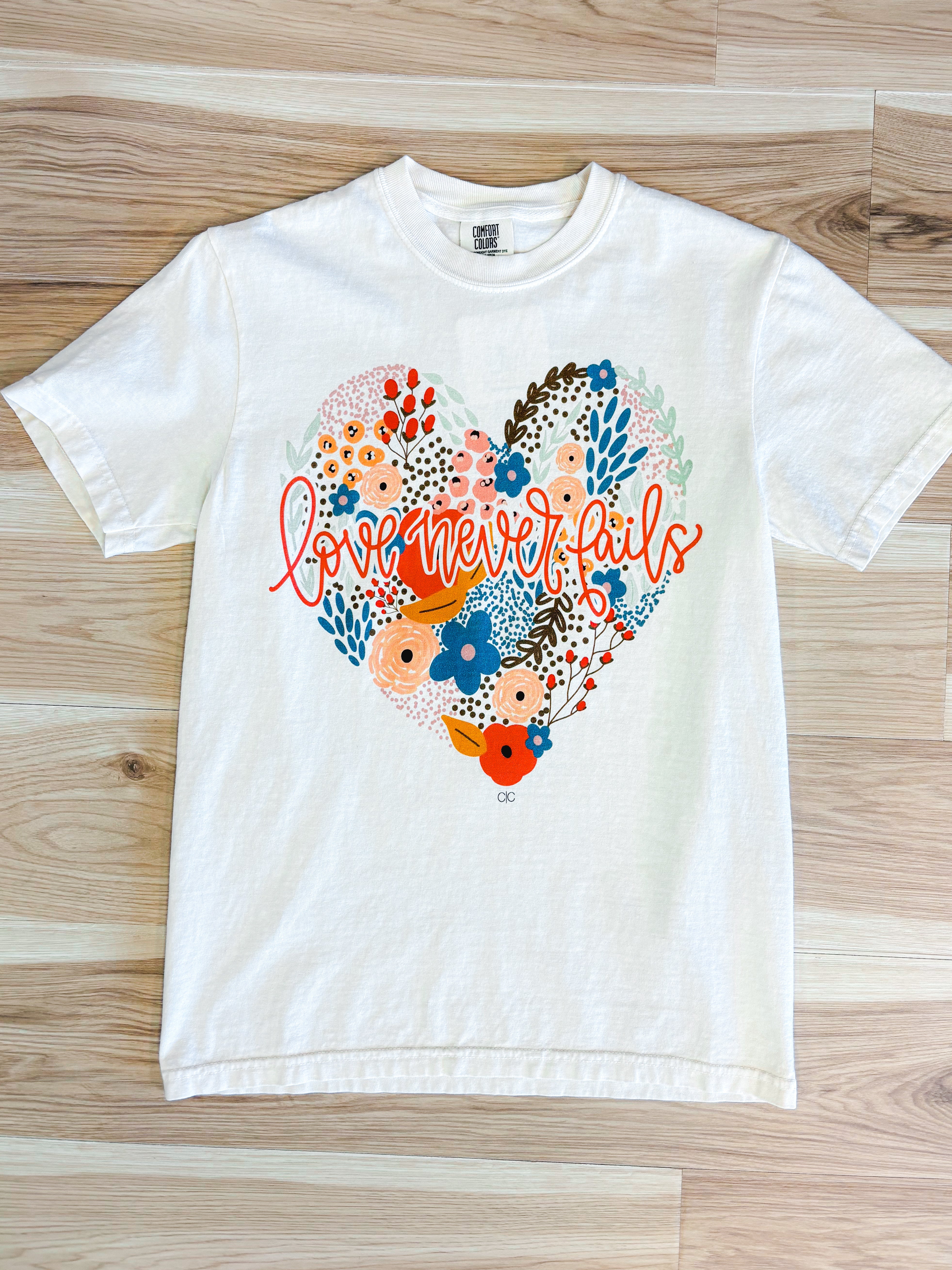Love Never Fails Graphic Tee - Ivory - Lace and Grace Boutique