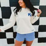 Long sleeve Kentucky & Wildcat embroidered mock neck sweatshirt in cream.