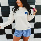 Long sleeve Kentucky & Wildcat embroidered mock neck sweatshirt in cream.