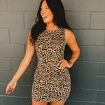 Leopard denim mini fitted dress with a boat neckline and zip-up closure.
