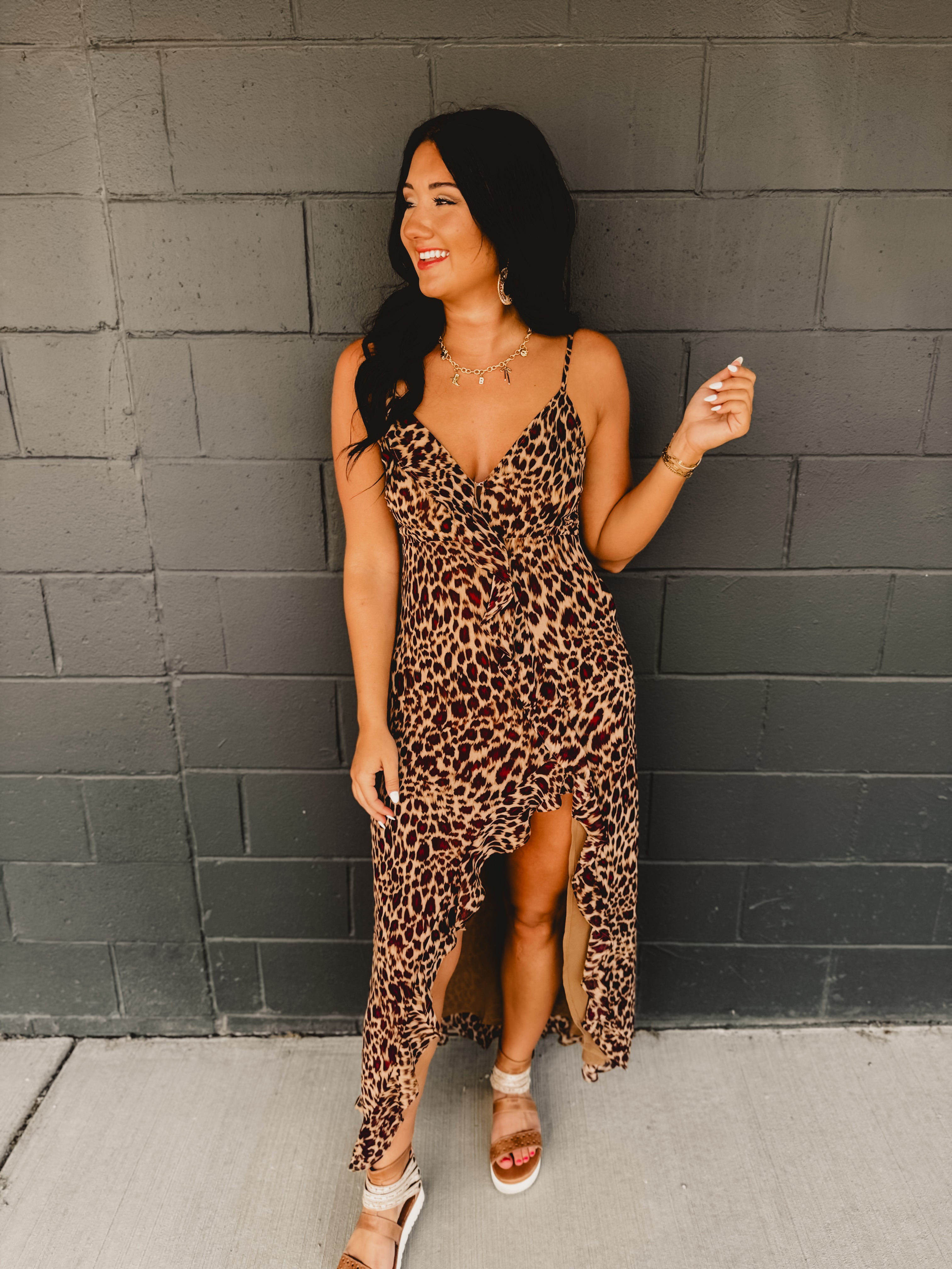 Asymmetrical v-neck leopard ruffle trim spaghetti strap midi length dress.
