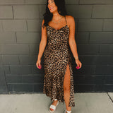 Cowl neckline spaghetti strap satin leopard print maxi dress with high side slit.