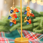 Linked Christmas light bulb drop dangle earrings in multicolor.