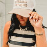 Adjustable two-tone beige/cream baseball cap that reads "Literally Just A Girl."