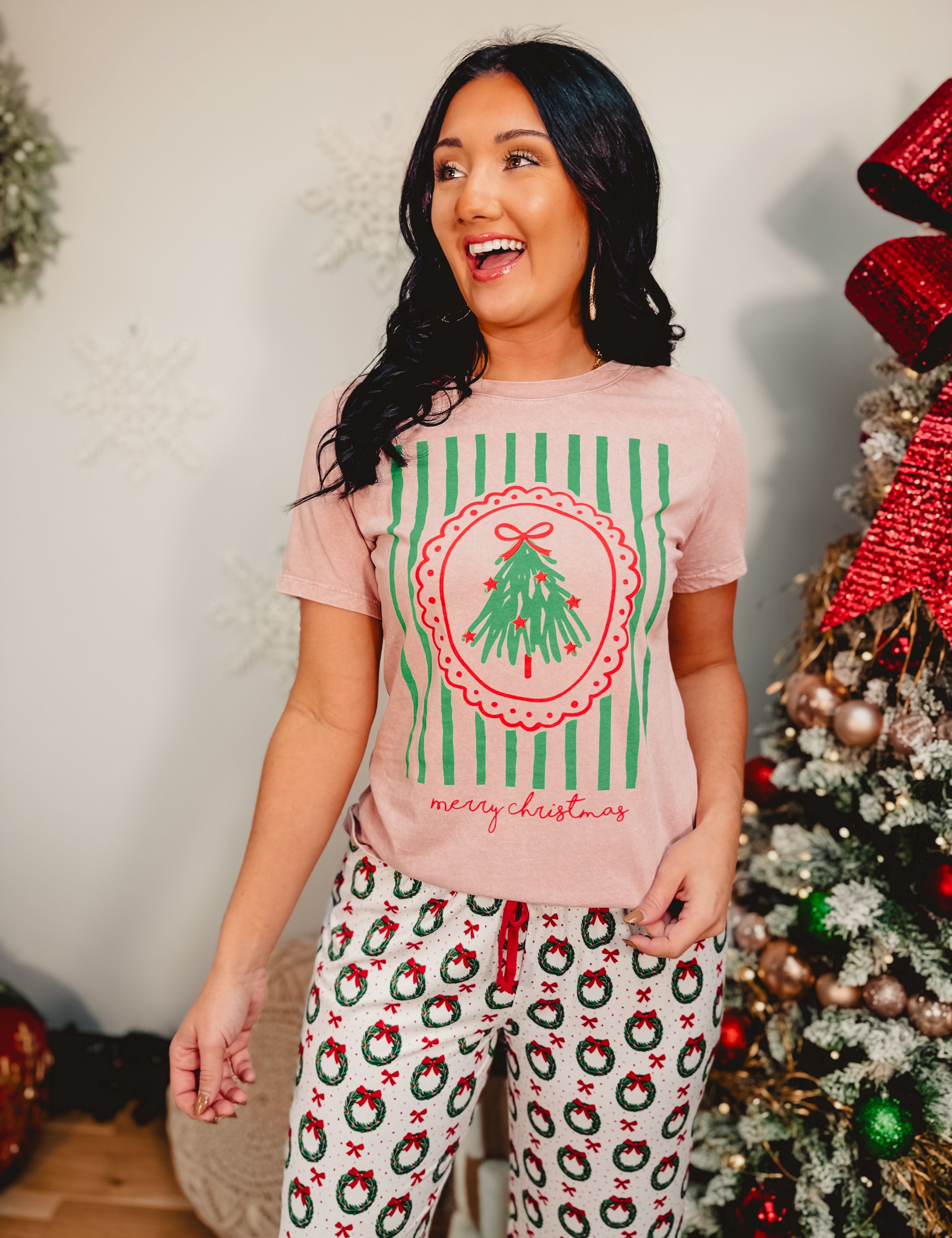 Light pink mineral washed Merry Christmas short sleeved graphic tee.