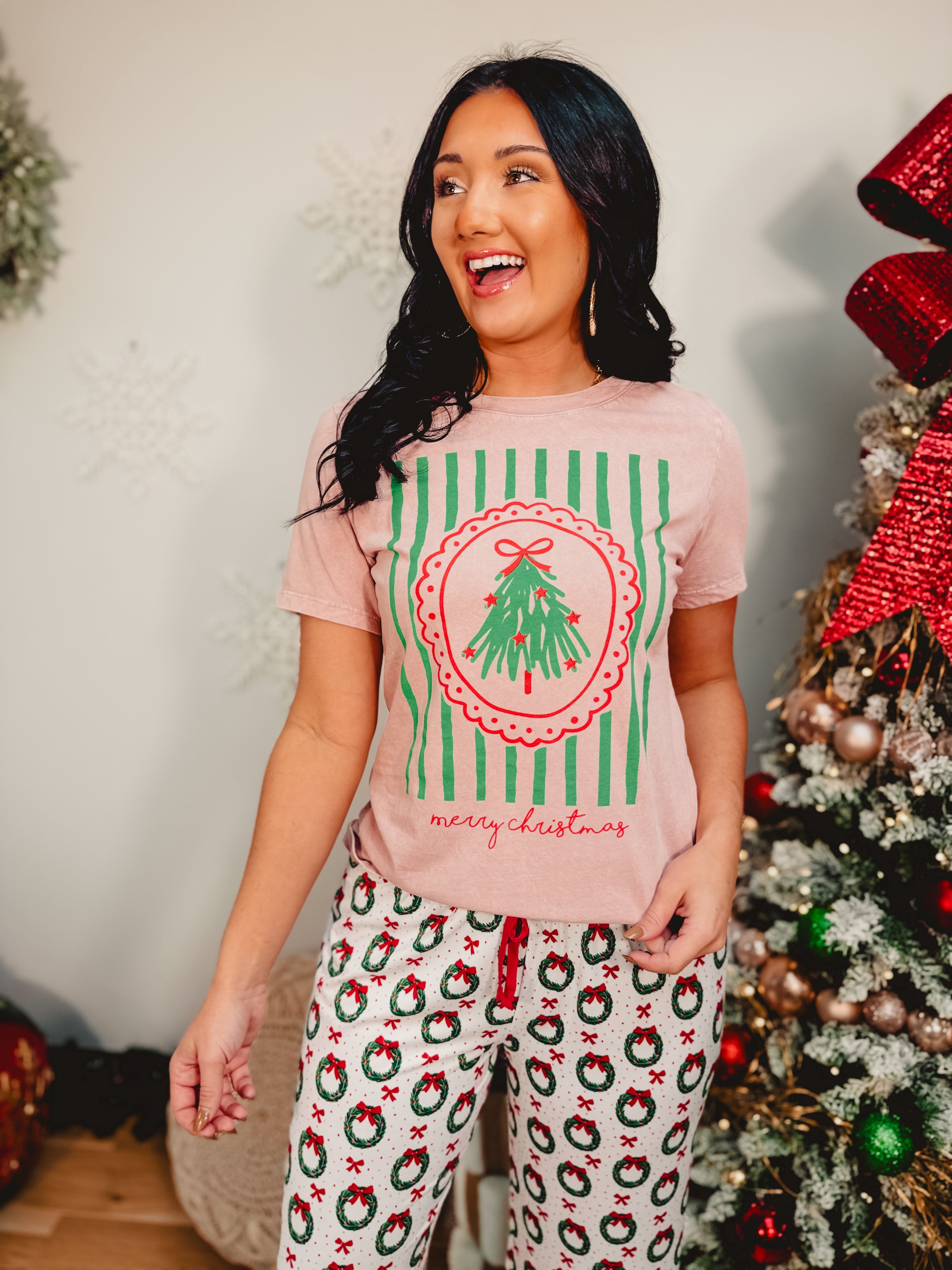 Light pink mineral washed Merry Christmas short sleeved graphic tee.