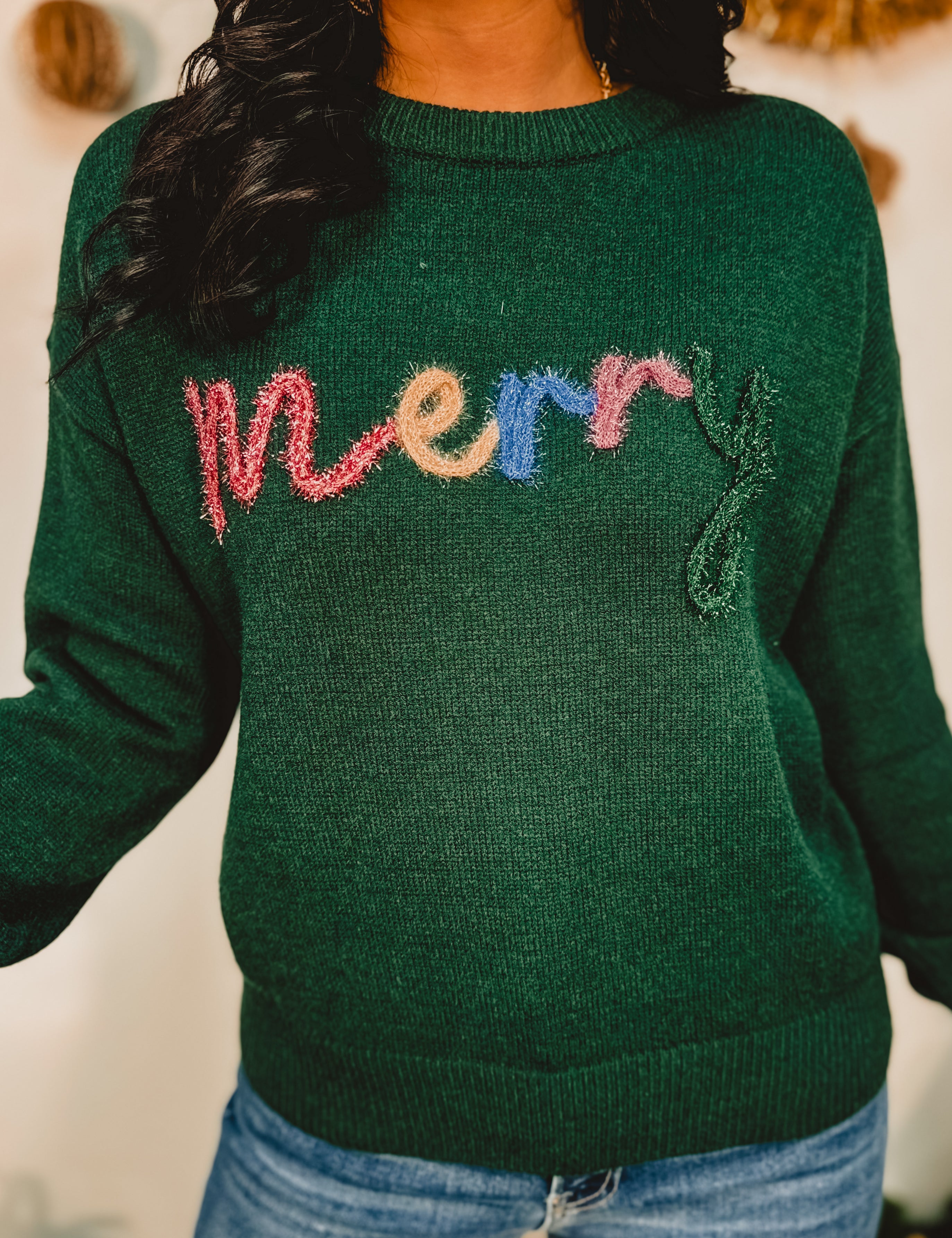 Merry tinsel lettering crewneck pullover sweater in hunter green.
