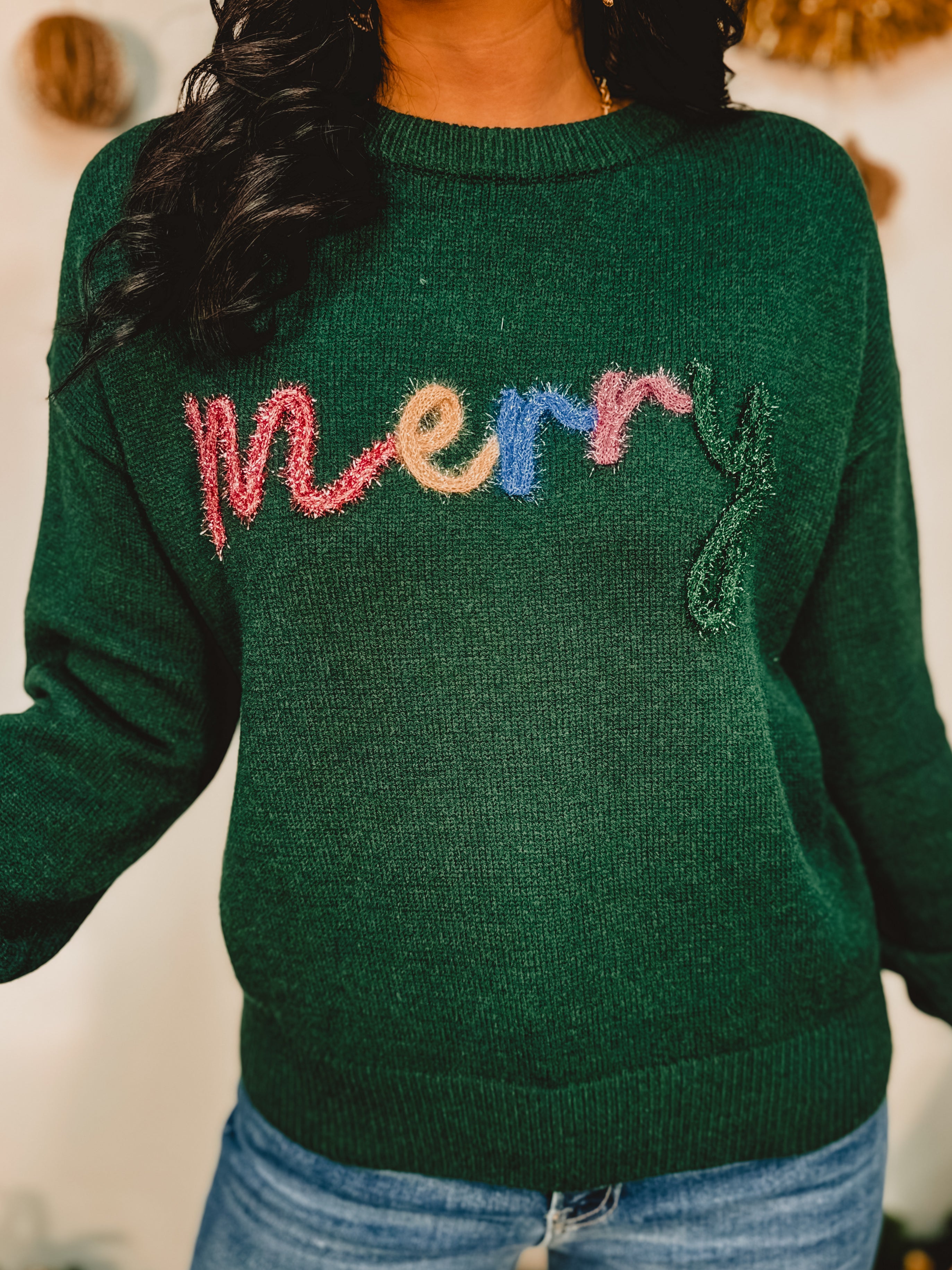 Merry tinsel lettering crewneck pullover sweater in hunter green.