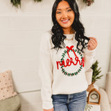 Merry wreath decorated in a bow knit fabric long sleeve sweater in white.