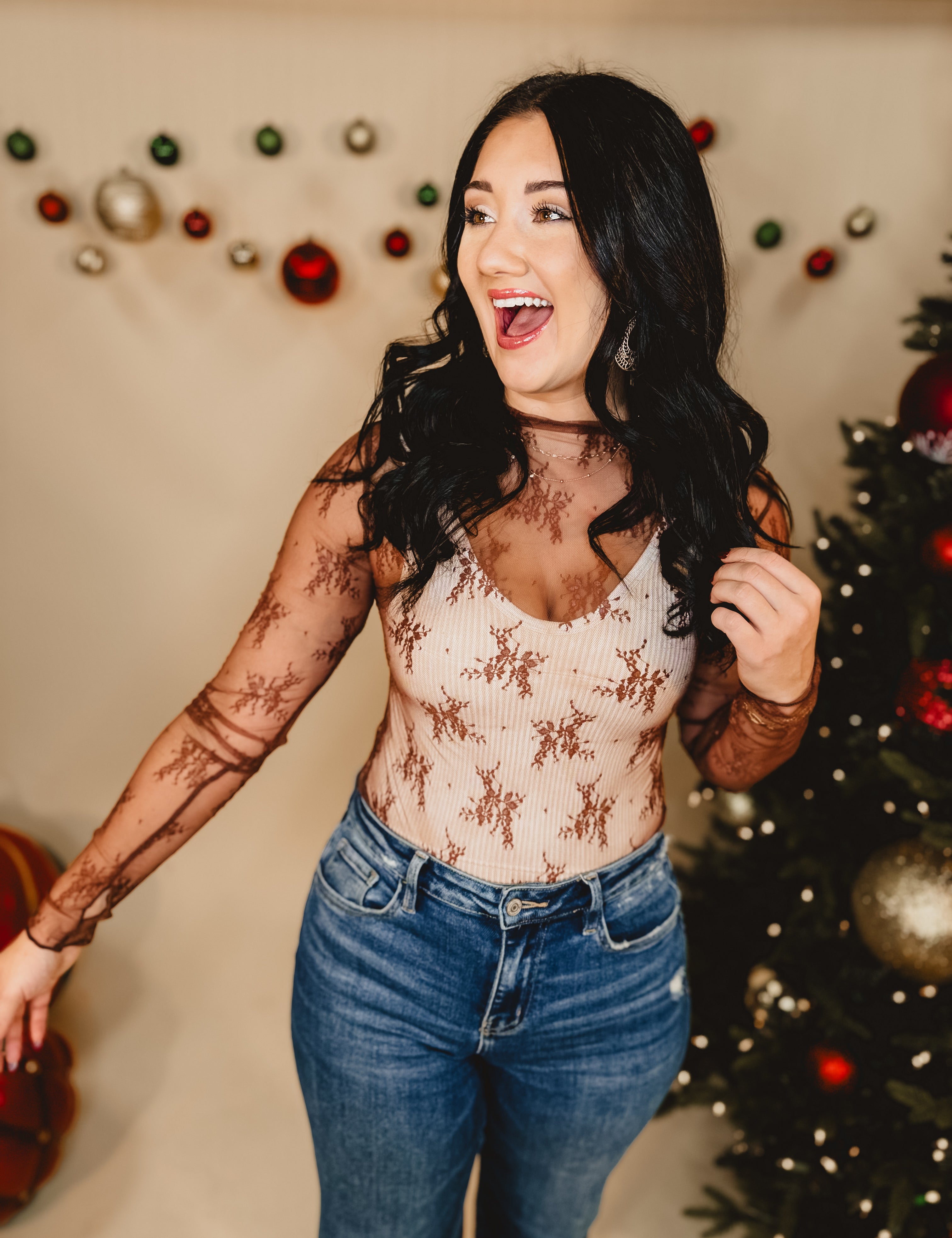 Mesh high neck long sleeve lace top with thumb holes and stretch.