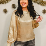 Metallic woven balloon sleeve blouse in gold.