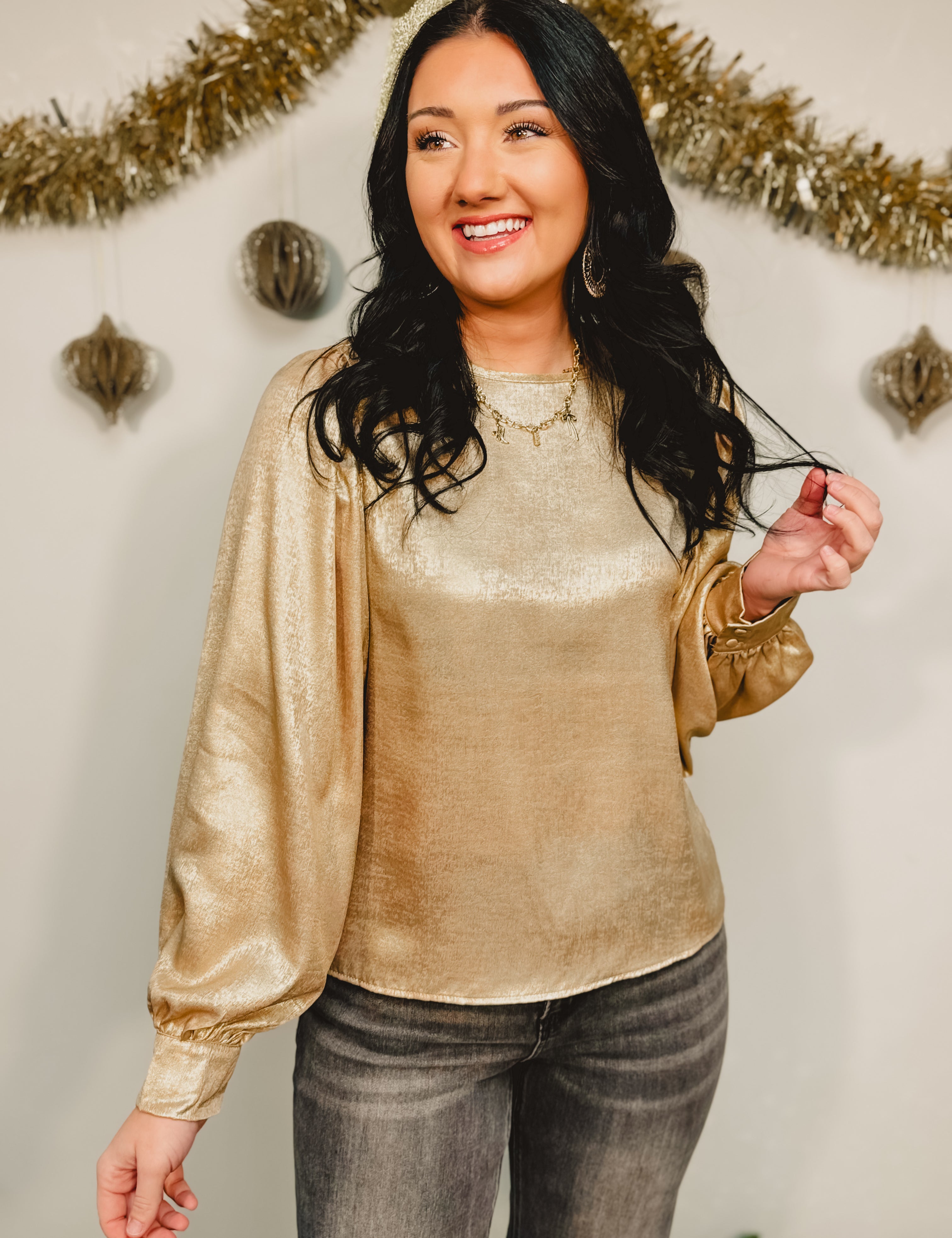 Metallic woven balloon sleeve blouse in gold.