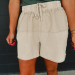 Contrast fabric mineral wash terry knit shorts with an elastic waistband and drawstrings in khaki.