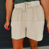 Contrast fabric mineral wash terry knit shorts with an elastic waistband and drawstrings in khaki.