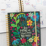 Natural Life 2025-2026 17 month planner including extra pockets, holiday and goal sections, stickers, and exterior artwork.