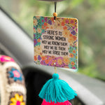 Natural Life car air freshener in voilet-scented essential oil freshie that reads "Here's to strong women. May we know them, may we be them, may we raise them."