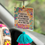 Natural Life car air freshener in voilet-scented essential oil freshie that reads "Here's to strong women. May we know them, may we be them, may we raise them."