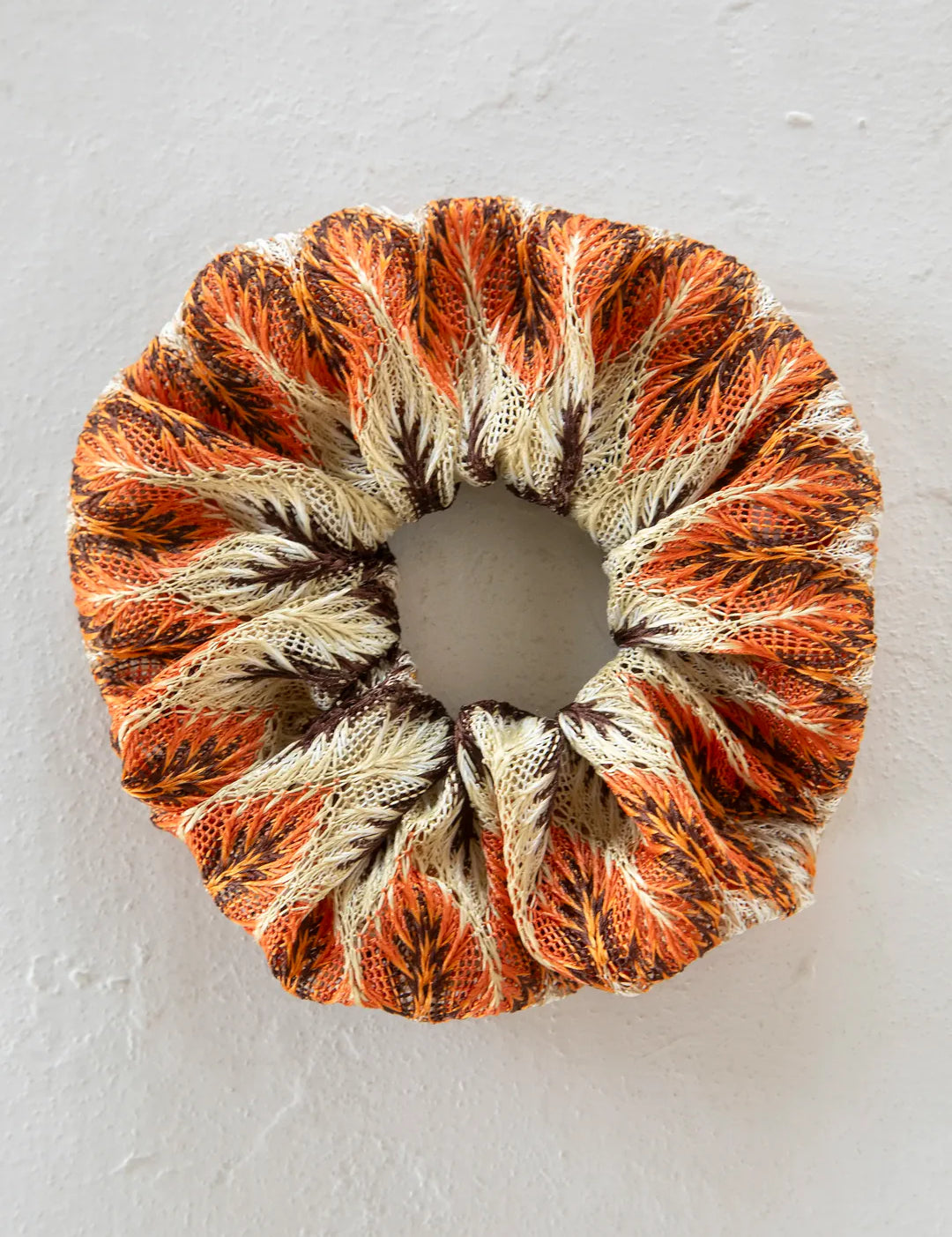 Natural Life burnt orange multi scrunchie ponytail holder.