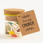 Natural Life multicolor daisy choker in little glass and cork jar.