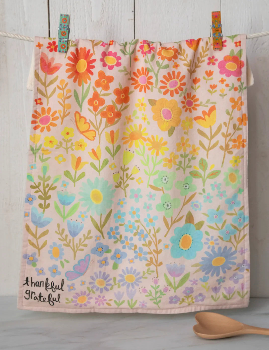 Colorful floral cotton dish towel by Natural Life that reads "thankful, grateful" in the corner.