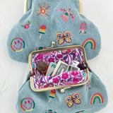 Embroidered kisslock coin purse with graphics by Natural Life in denim.