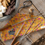 Natural Life campfire roasting sticks including a floral cloth carrier for storage that reads: "Making S'more Memories."