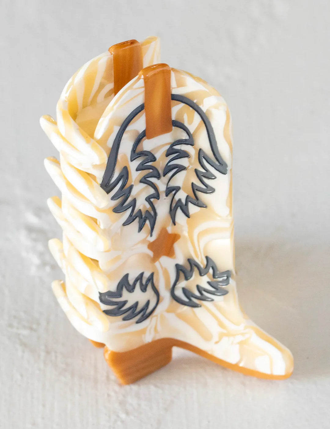 Natural Life boot hair clip in the color cream/tan.
