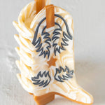 Natural Life boot hair clip in the color cream/tan.