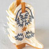 Natural Life boot hair clip in the color cream/tan.