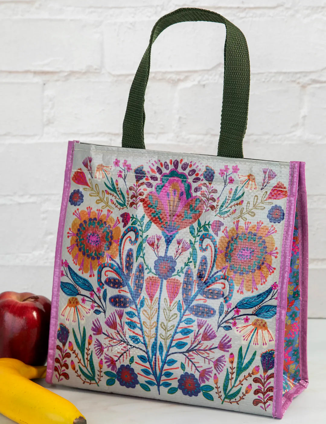 Natural Life insulated foldable lunch bag with velcro closure and straps for handles in the pattern cream folk flower.