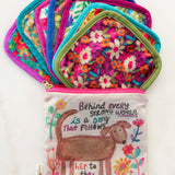 Seven reusable mini makeup cloths in storage pouch by Natural Life.