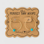 Gold hoop earrings with turquoise beads by Natural Life.