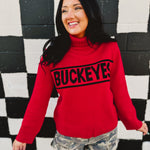 Ohio State licensed rolled turtle neck sweater in red that reads "Buckeyes."