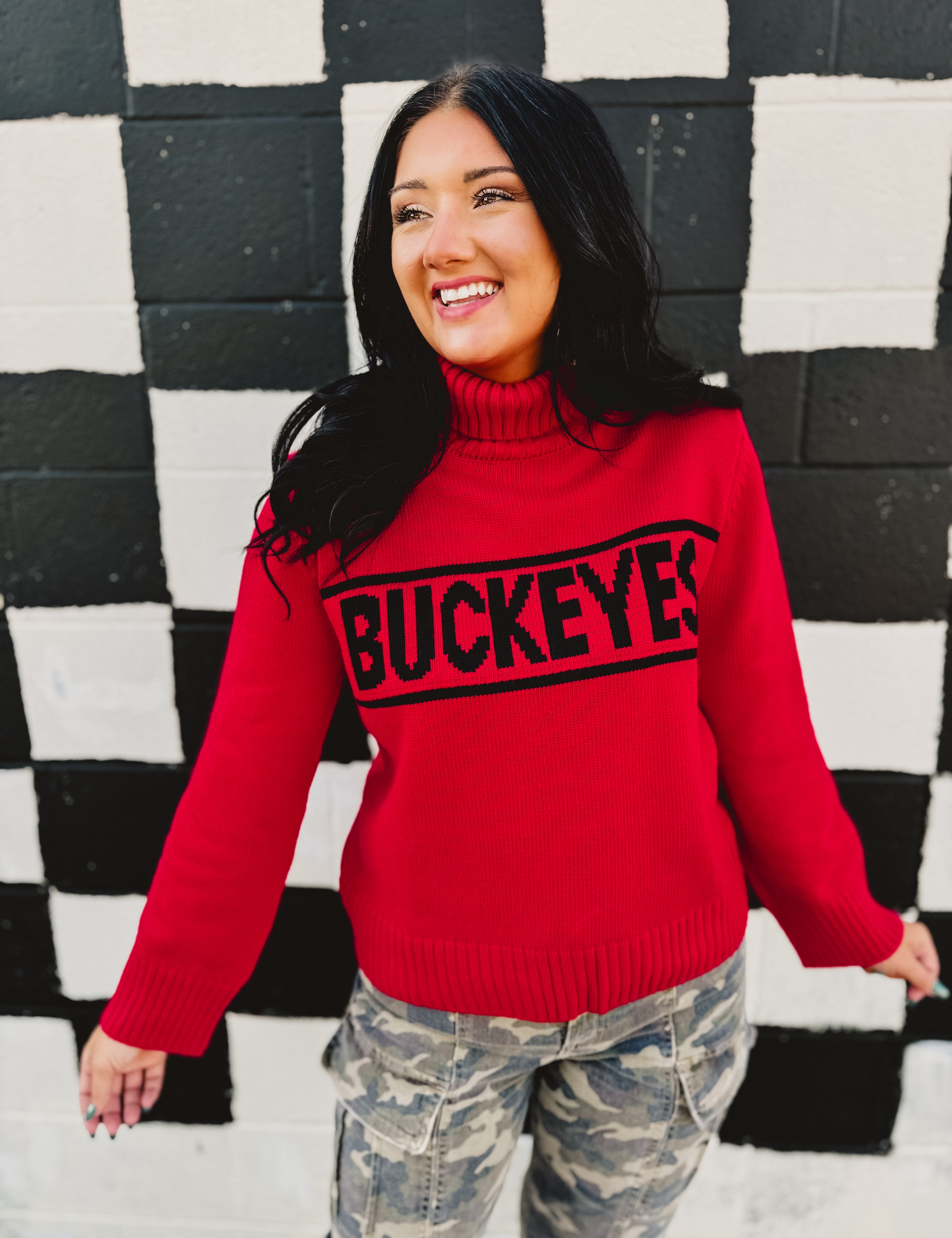 Ohio State licensed rolled turtle neck sweater in red that reads "Buckeyes."