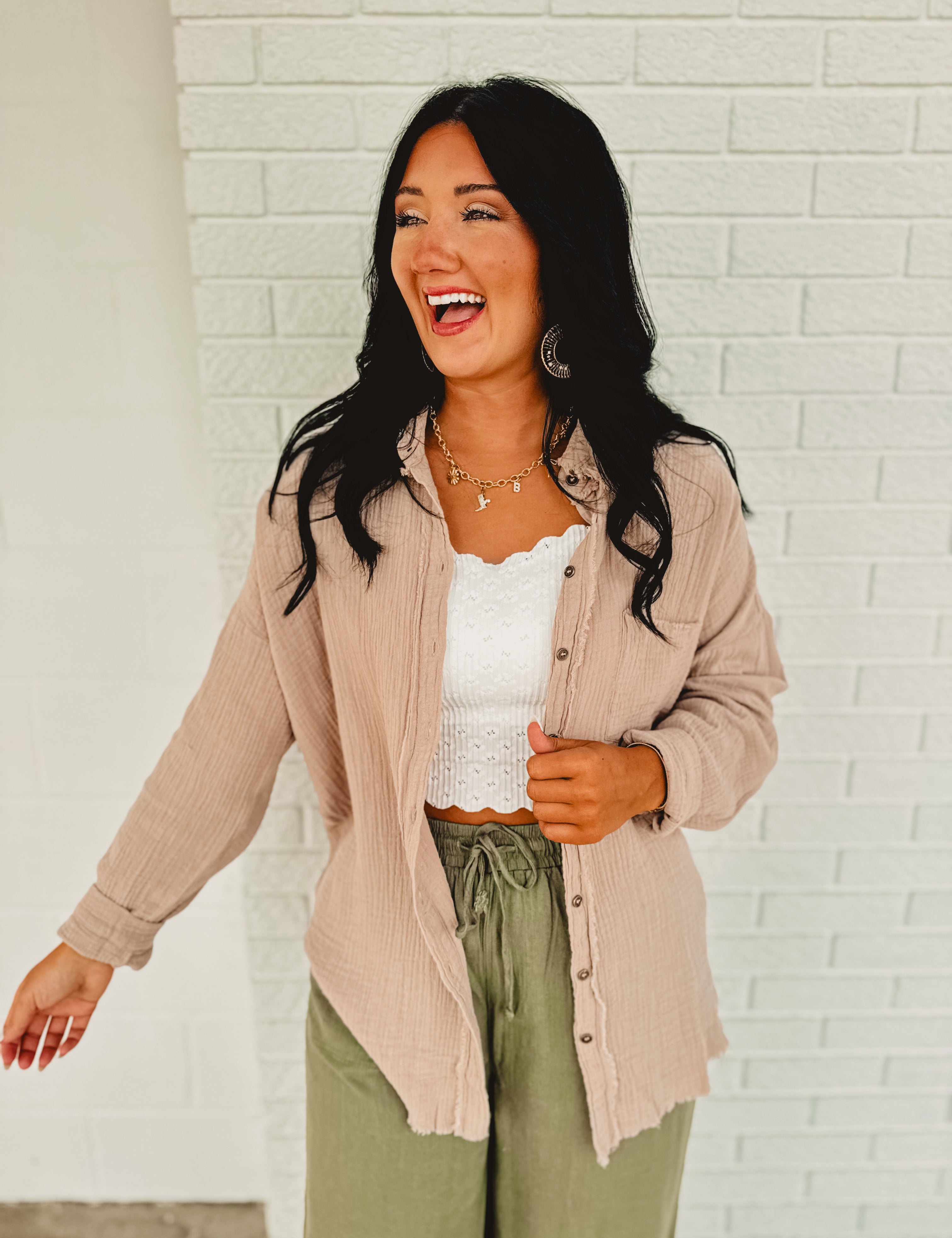 Raw edge oversized button up collard long sleeve top in a gauze material and in the color ash mocha.