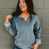 Long sleeve zip-up blue pigment-dyed pullover.