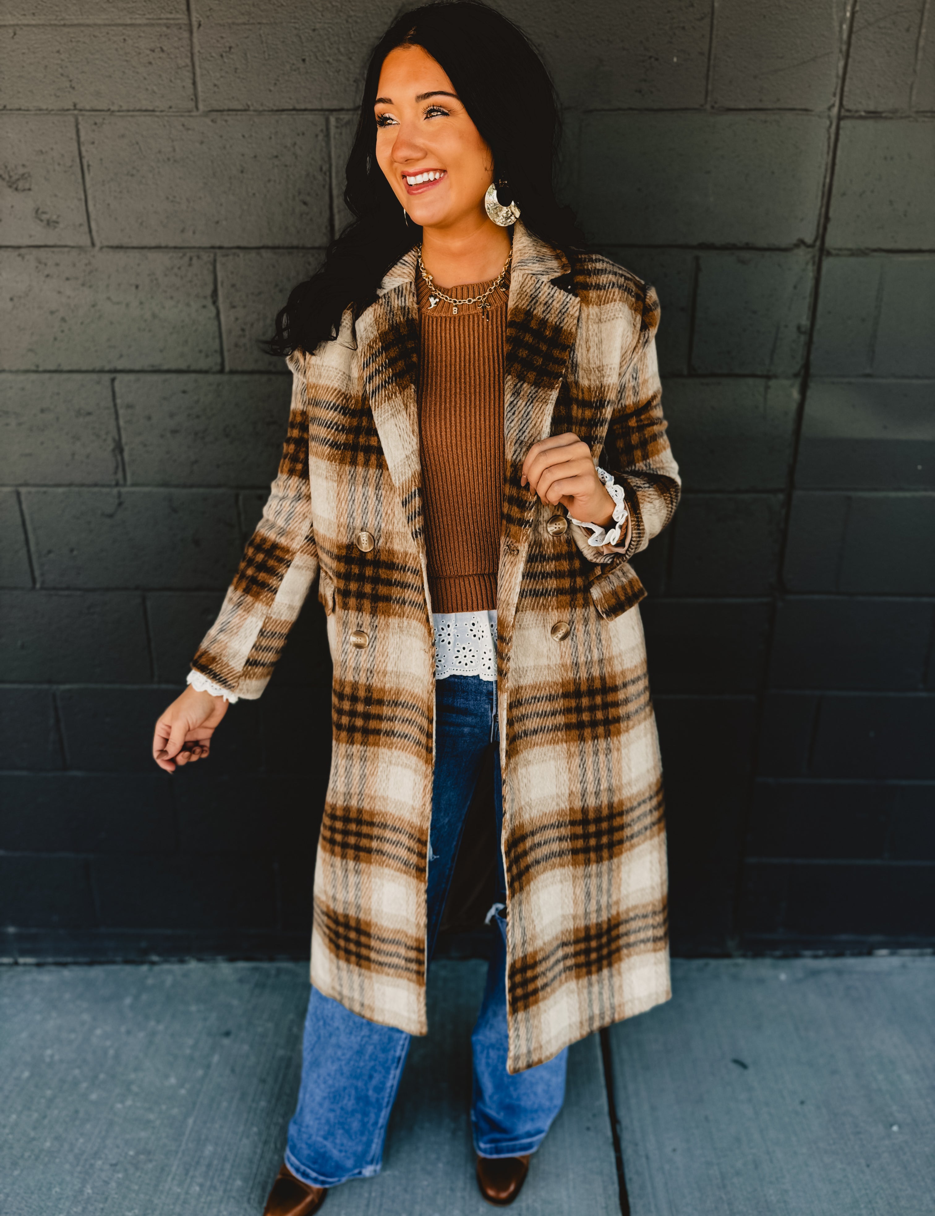 Plaid printed longline duster coat with pockets in the color fawn.