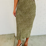 Dot printed midi skirt in the color olive with zip-up closure.