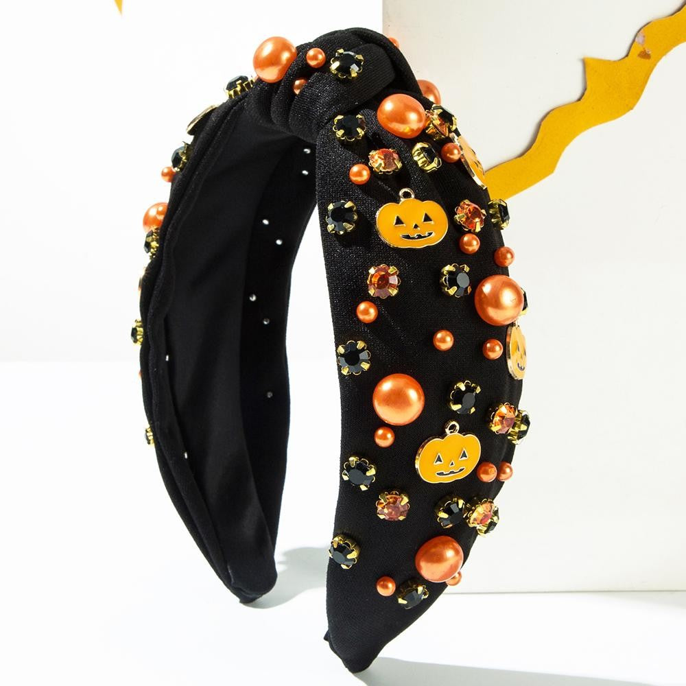Pumpkin, pearl, and rhinestone studded knot headband.
