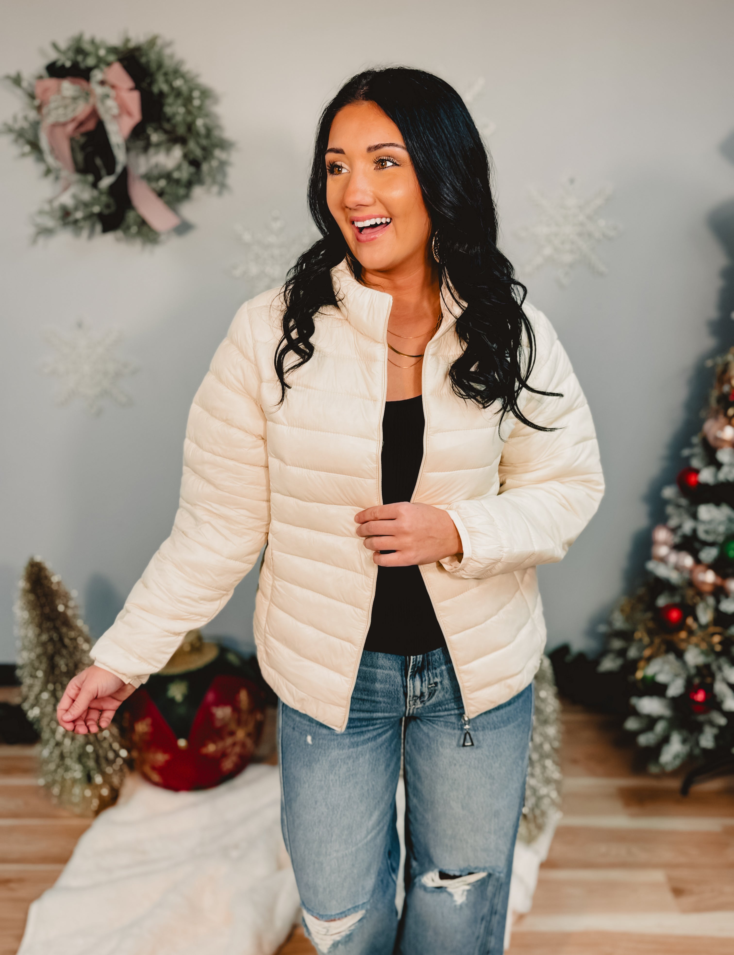 Quilted zip-up puffer jacket in off white.