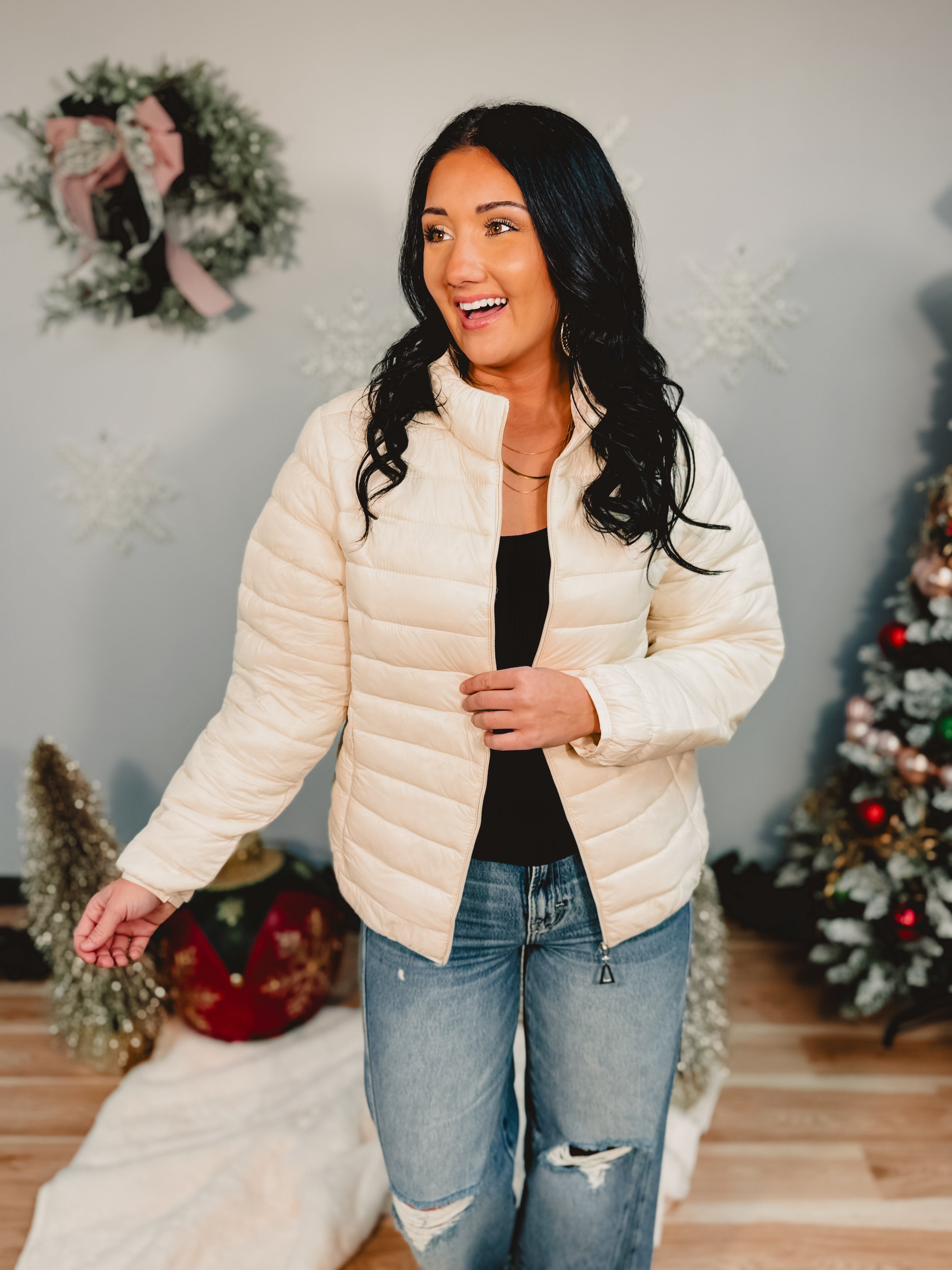 Quilted zip-up puffer jacket in off white.