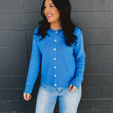 Raw rolled edge button up sweater cardigan with a round neckline in blue.